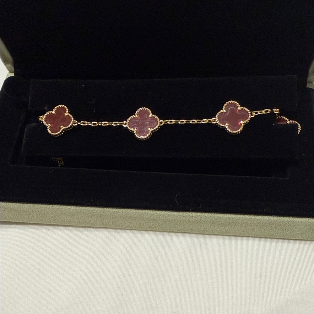 Elegant Gold and Red Clover Bracelet